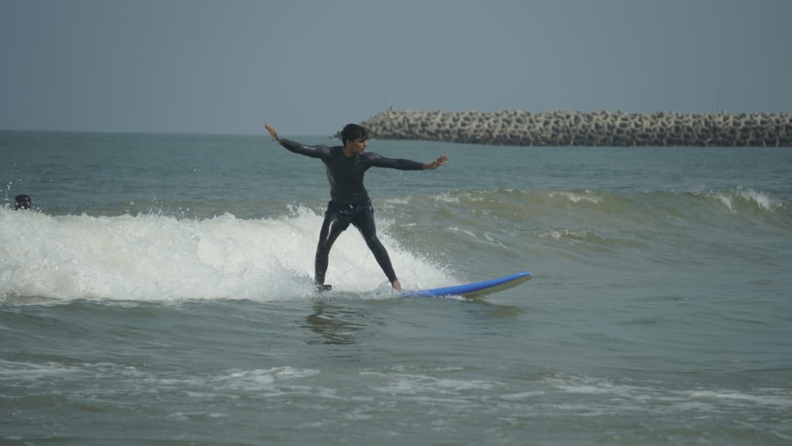 Nimitt riding a wave at Mulki